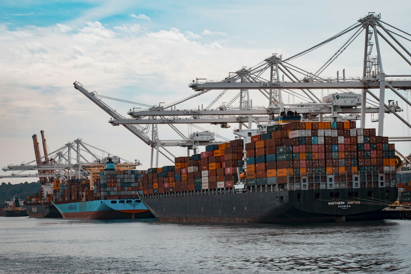 Mobile phone imports in Pakistan – cargo ships docked at a port