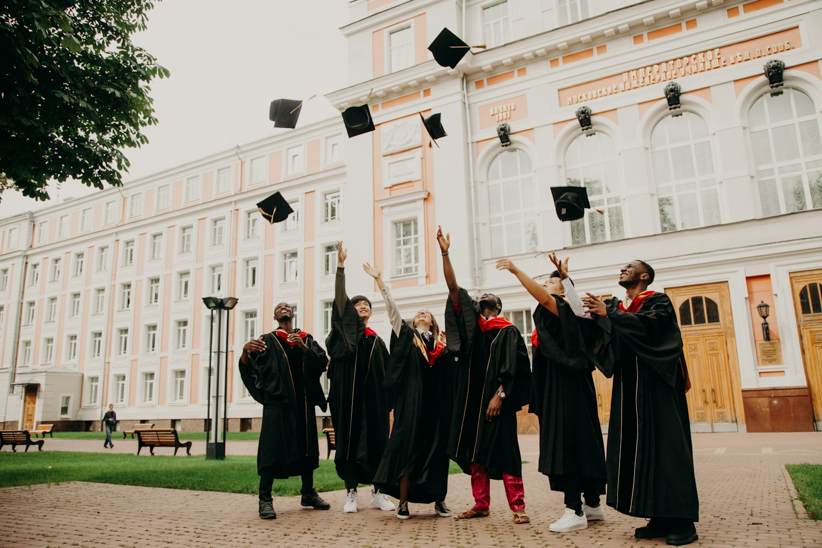 HEC degree attestation – graduates throwing their caps in the air