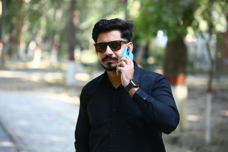Best mobile network in Pakistan – a man talking on a mobile phone outdoors