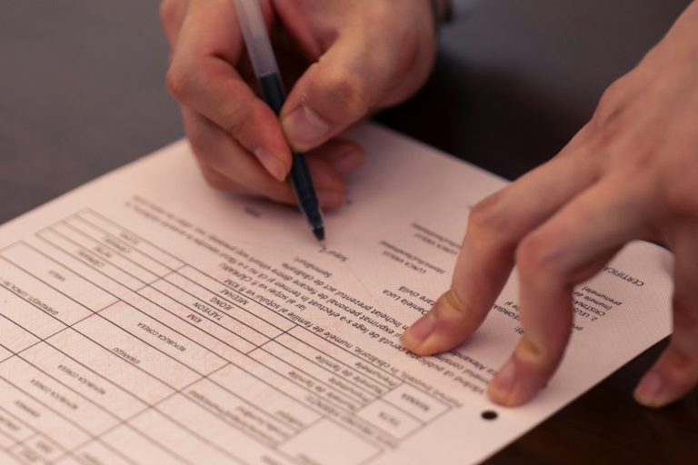 Asaan Khidmat Centres – hands signing an official document